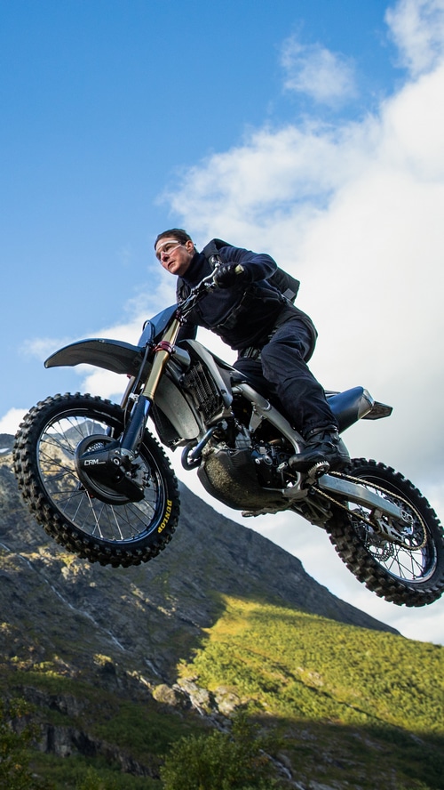 Tom Cruise performs a motorcycle stunt in Mission Impossible
