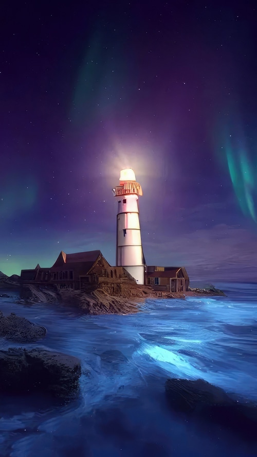 Lighthouse on a rocky shore under the aurora borealis