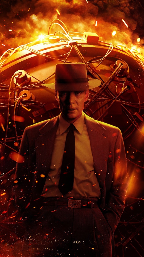 Cillian Murphy as Oppenheimer in front of a bomb