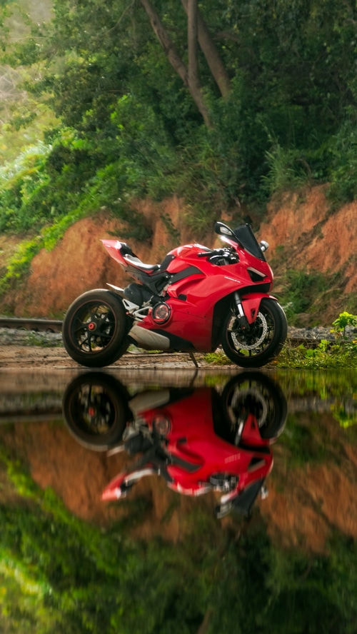 Red Ducati Motorcycle Reflection in Water