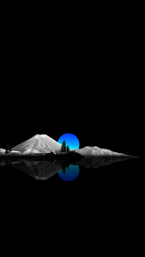 Mountains and sunset reflected in water