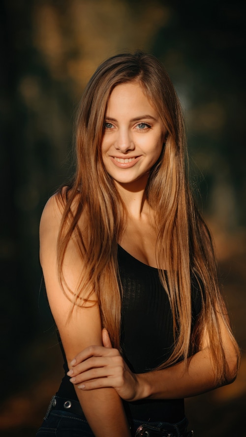 Young woman with long blonde hair smiling