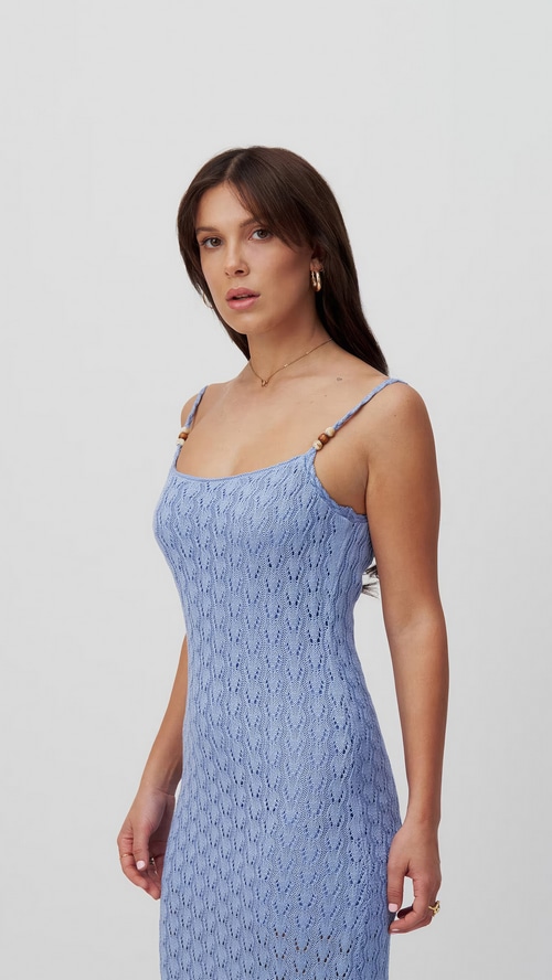 Millie Bobby Brown in a blue knit dress
