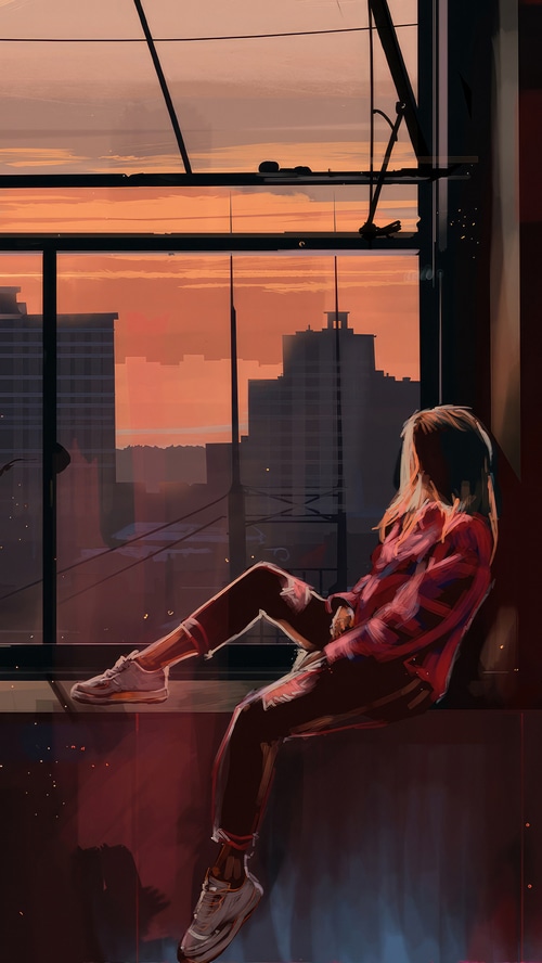 Girl sitting by the window at sunset