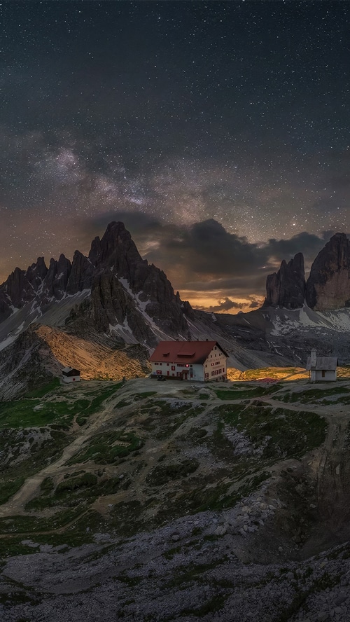Milky Way over mountain huts and peaks