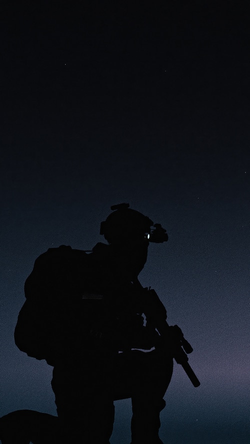 Soldier with night vision goggles and rifle