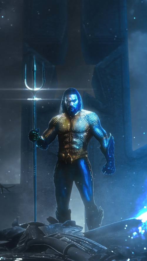 Aquaman holding a trident in a dark, misty environment