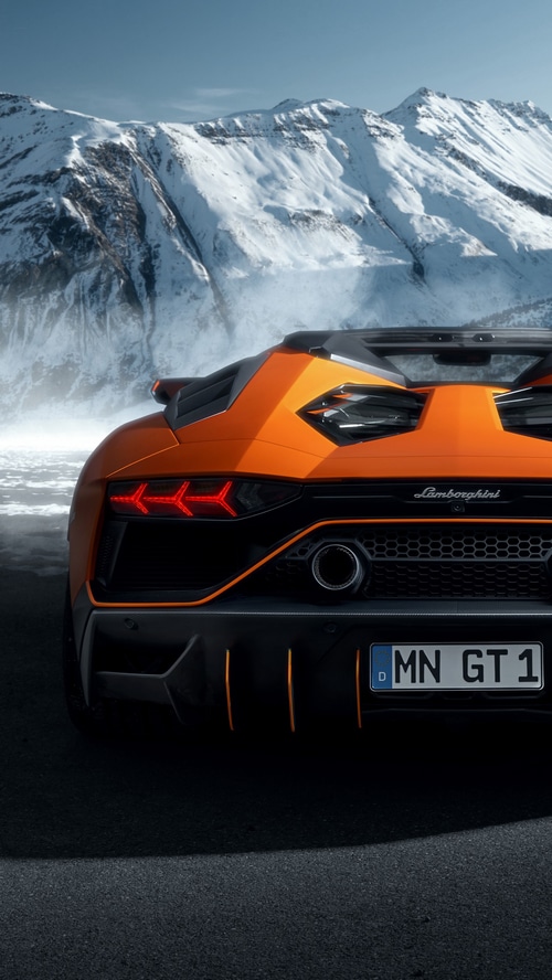 Lamborghini Aventador rear view in snowy mountains