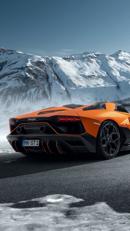 Orange Lamborghini Aventador in Snowy Mountains