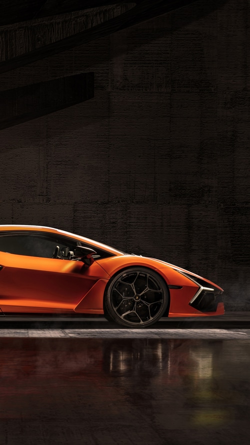 Orange Lamborghini Revuelto in a Dark Garage