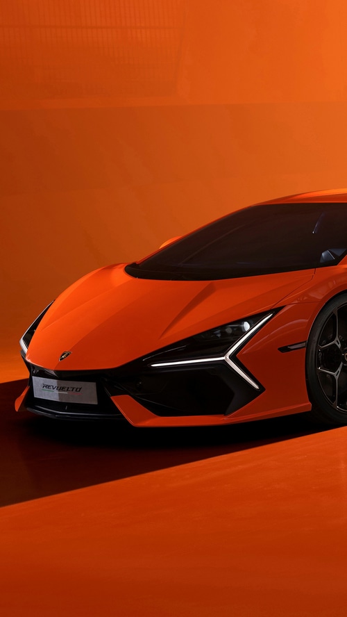 Lamborghini Revuelto front view on orange background
