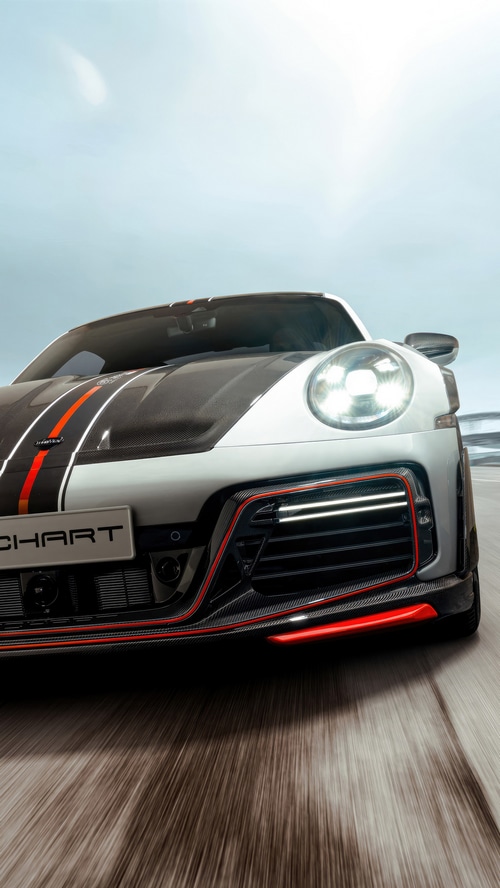 Porsche 992 with racing stripes on the road