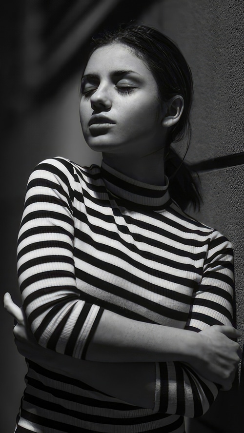 Delaia Gonzalez in a striped turtleneck