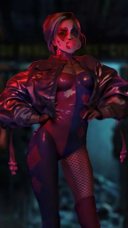 Harley Quinn blowing a bubble with a diamond pattern suit