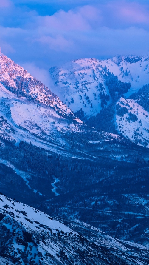 Snow-covered mountains at sunrise