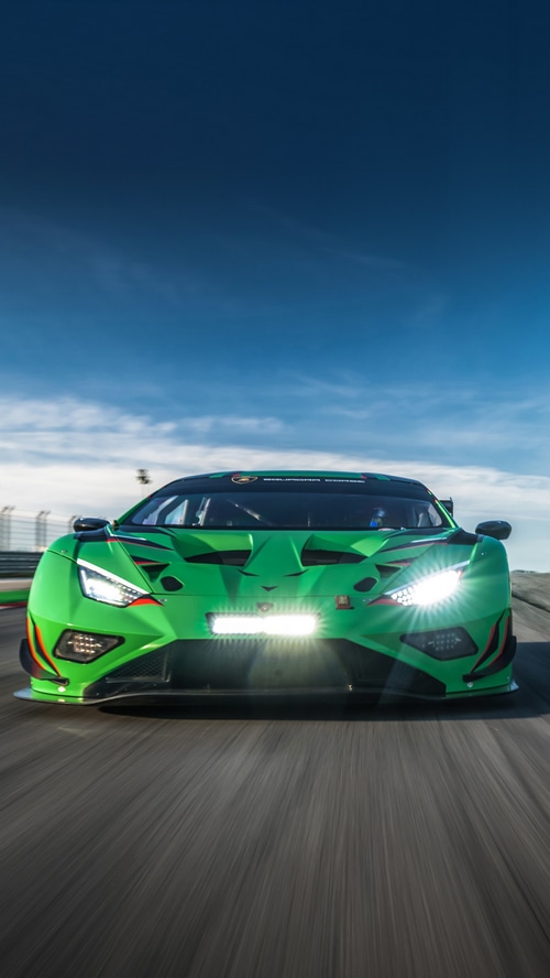 Green Lamborghini Huracan race car on track