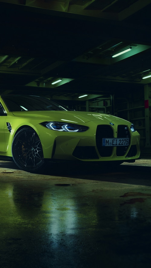 Yellow BMW M4 parked in a garage