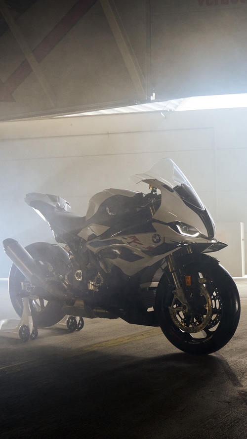 BMW S 1000 RR motorcycle in a smoky garage