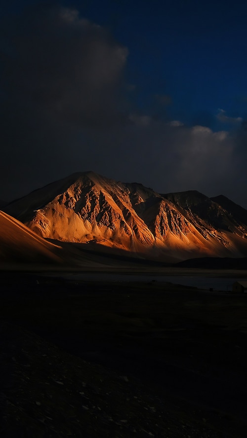 Golden mountain range at sunset