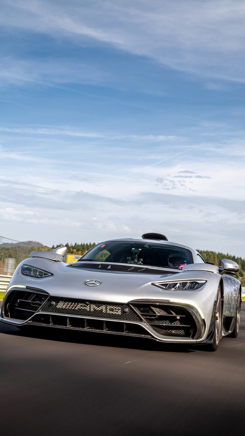 Silver Mercedes-AMG ONE driving on a track