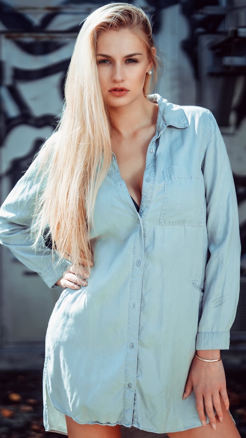 Blonde model in a light blue shirt