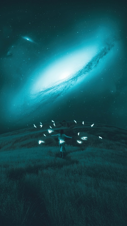 Girl with glowing birds and a galaxy