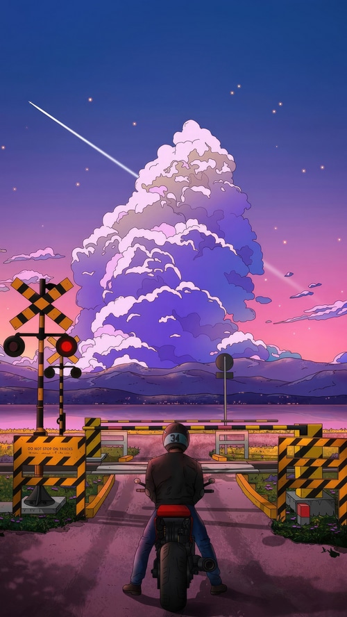 Biker at Railroad Crossing During Sunset