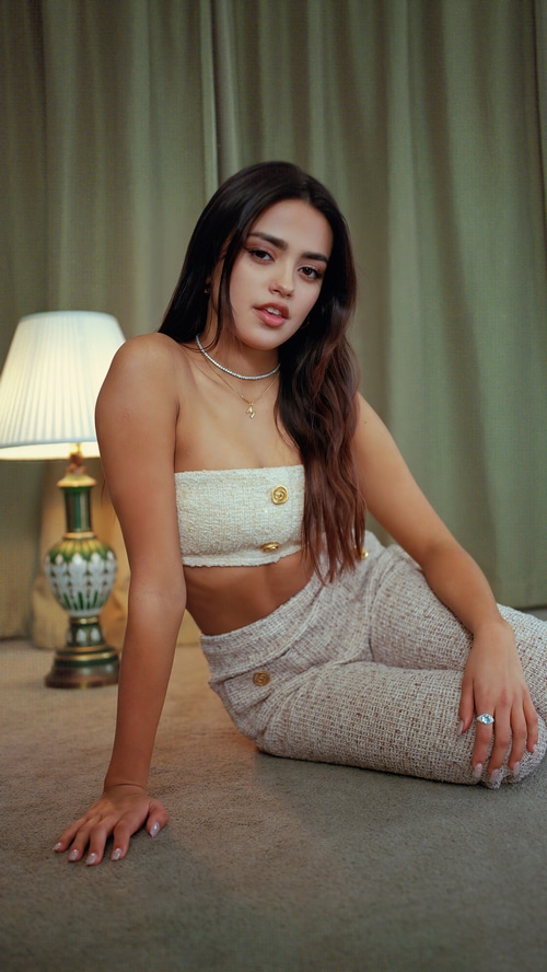 Maia Reficco in a white tube top and pants