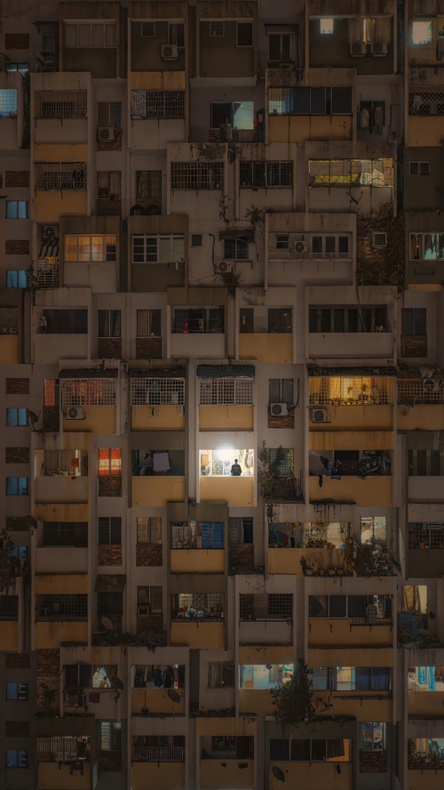 Apartment building at night with illuminated windows