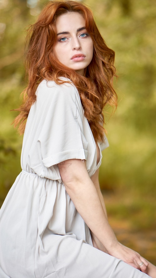 Redhead model in a light dress