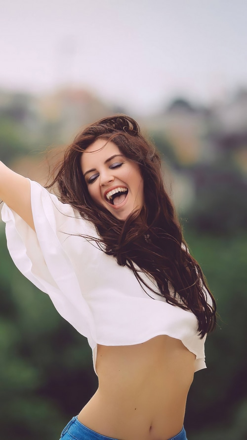 Aurela Skandaj laughing outdoors