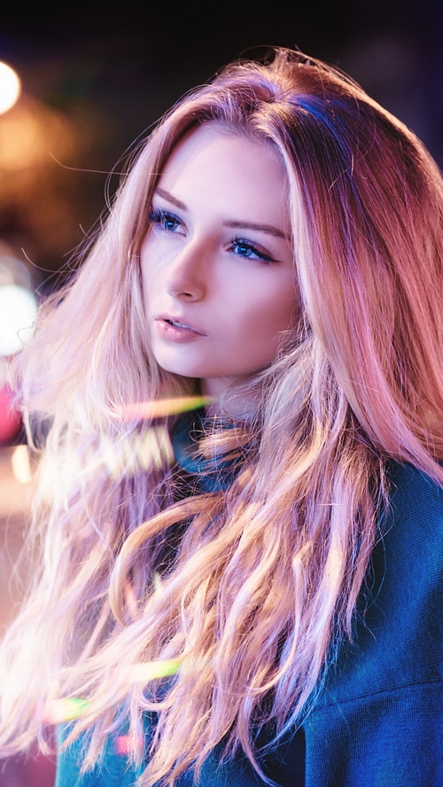 Blonde girl with blue eyes and pink hair