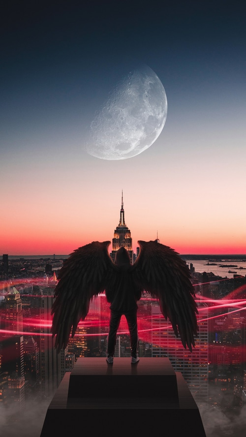 Angel with wings overlooking New York City at sunset