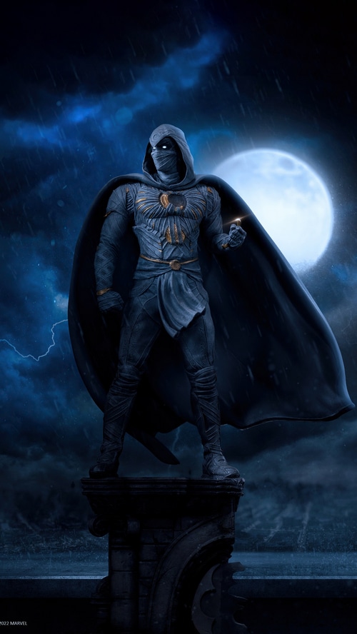 Moon Knight standing on a ledge at night