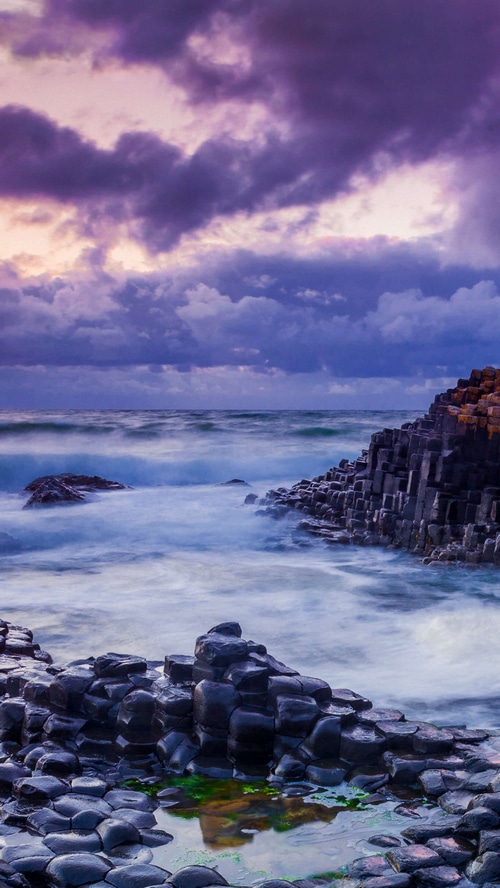 Giants Causeway rocks and ocean at sunset