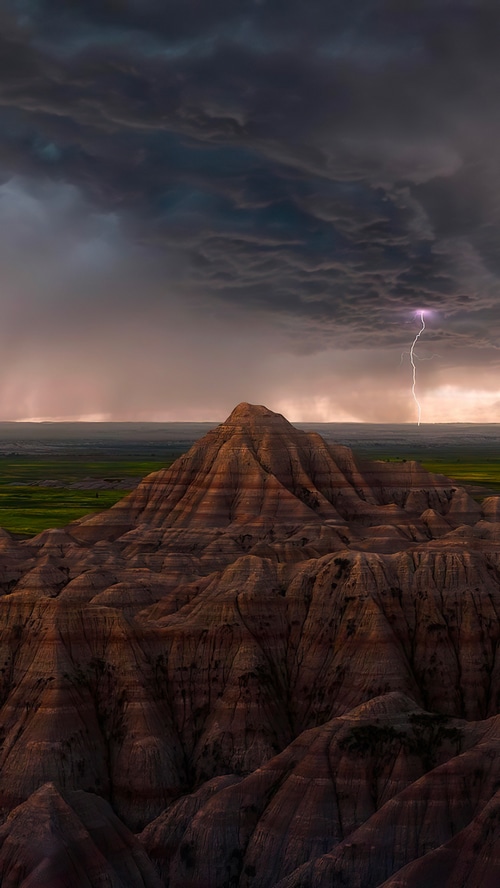 Lightning strikes over Badlands National Park during a thunderstorm