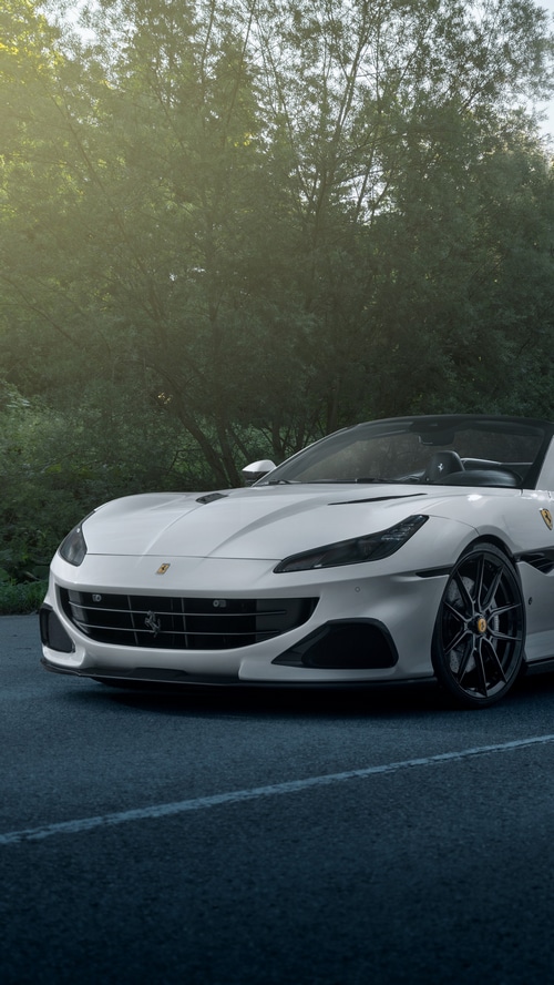 White Ferrari Portofino convertible parked on a road