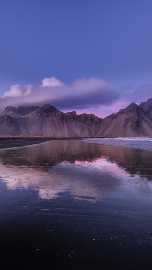 Mountains reflecting in water at Iceland