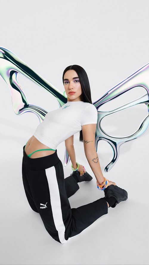 Dua Lipa in Puma athletic wear with butterfly wings
