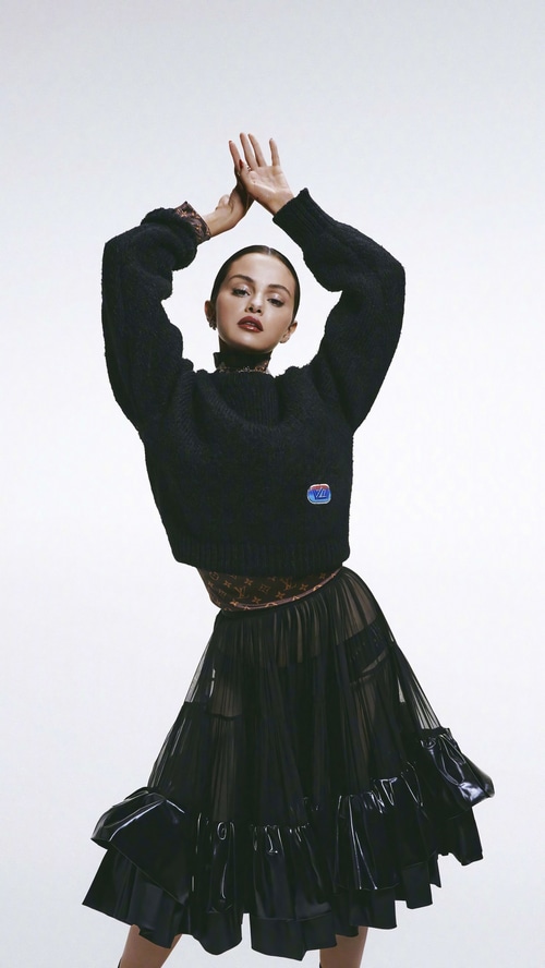 Selena Gomez in a black sweater and skirt