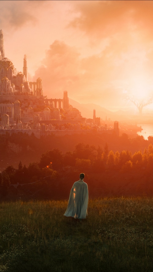 The Rings of Power: A figure gazes at a city at sunset