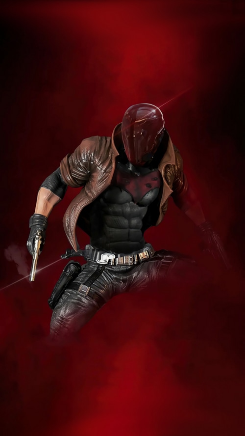 Red Hood holding a pistol