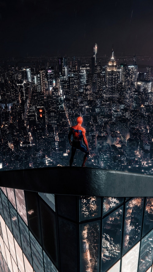Spider-Man overlooking a city at night