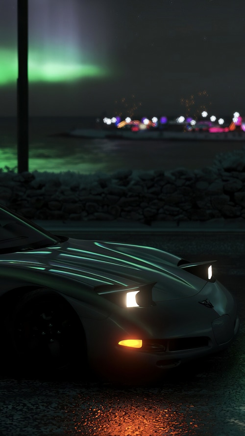 Chevrolet Corvette Z06 at night with aurora borealis