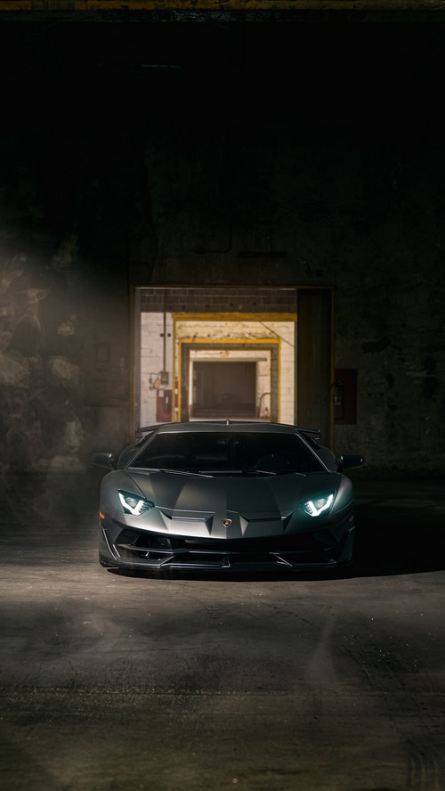 Lamborghini Aventador SVJ in a dark industrial setting