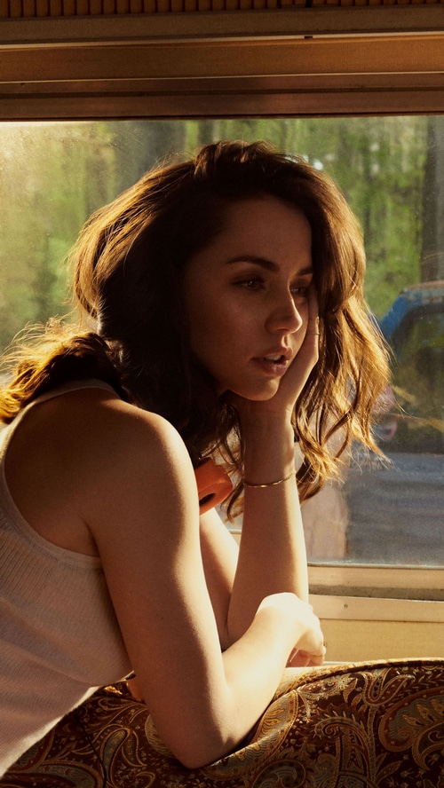 Ana de Armas looking out a window