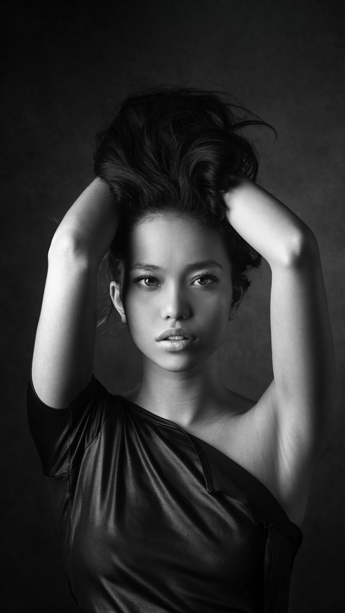 Monochrome portrait of a woman in a black dress