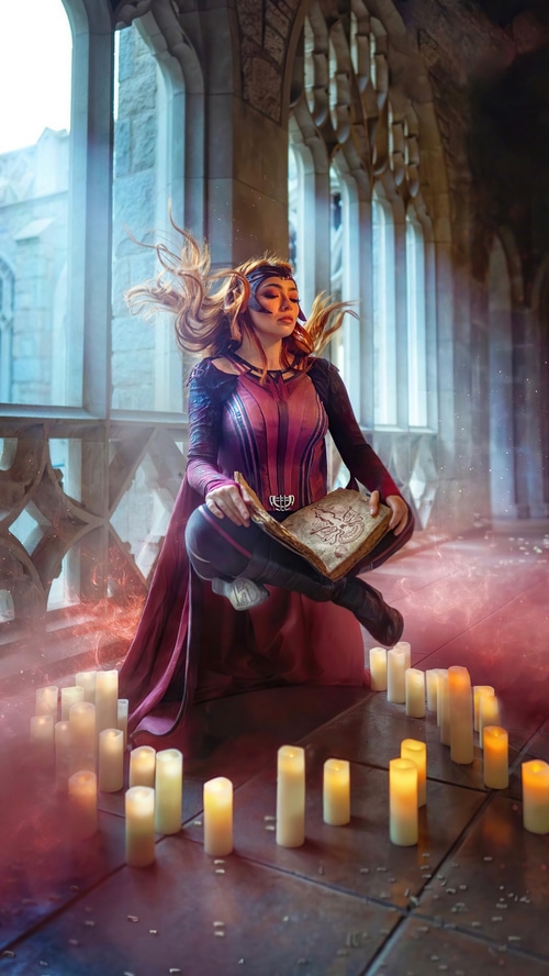 Scarlet Witch cosplay levitating with a book