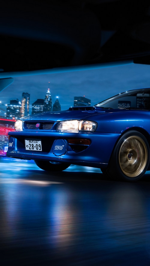 Blue Subaru Impreza WRX STI driving at night