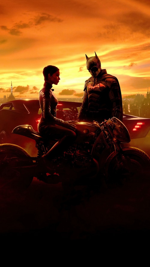 The Batman and Catwoman on a motorcycle